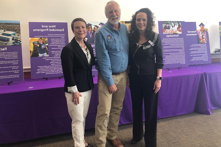 Three Board of Trustees members standing together